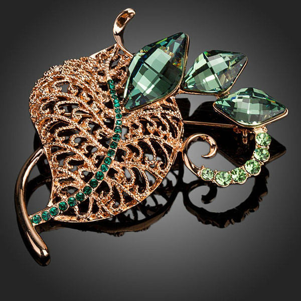 Khaista green botanical leaf pin brooch on white background
