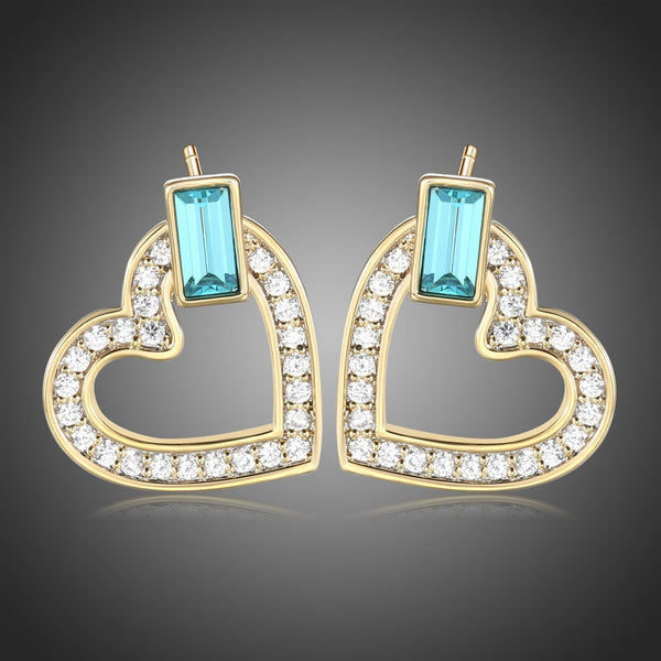 KHAISTA blue Austrian crystal heart stud earrings on white background