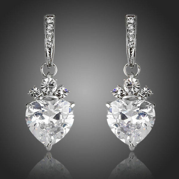 KHAISTA clear crystal heart drop earrings on white background