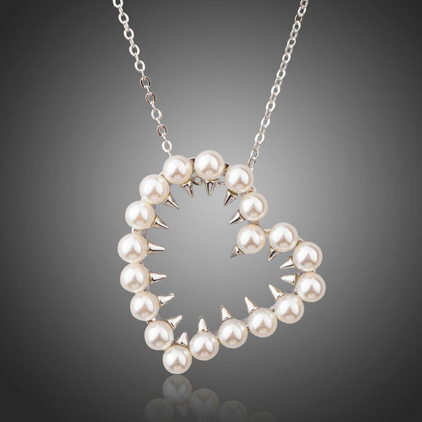 KHAISTA heart shaped pearl pendant necklace on white background