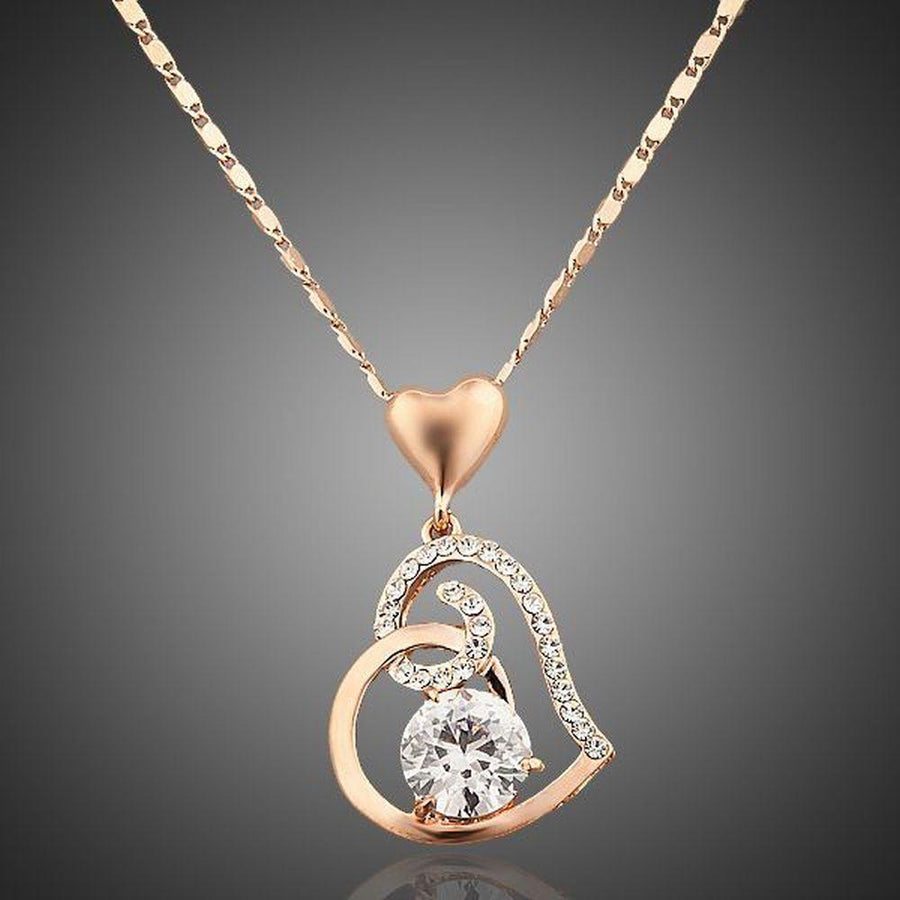 KHAISTA heart shaped snake chain crystal necklace on white background