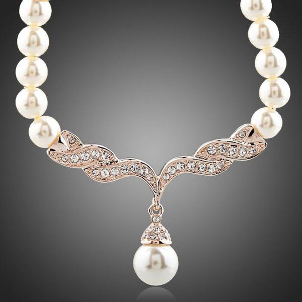 KHAISTA imitation pearl love crystal necklace on white background