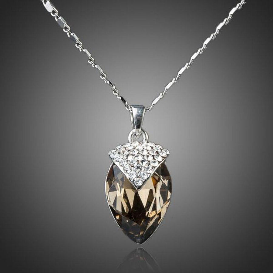 KHAISTA ink brown crystal pendant necklace on white background