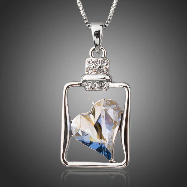 KHAISTA light blue crystal heart pendant necklace on white background