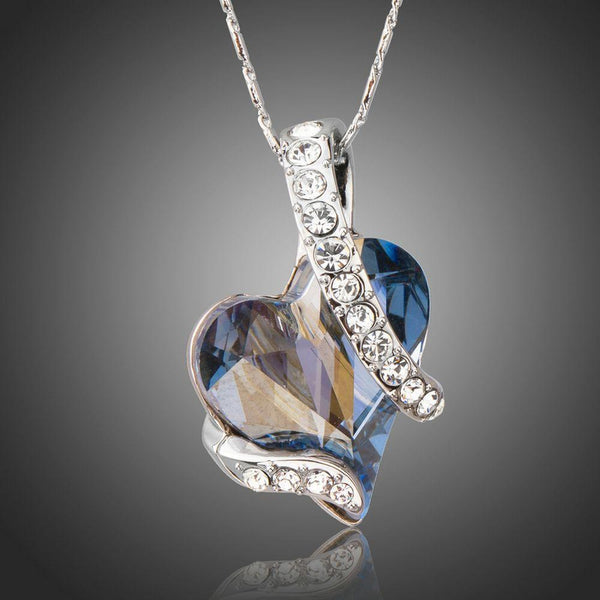 KHAISTA light blue crystal heart pendant necklace on white background