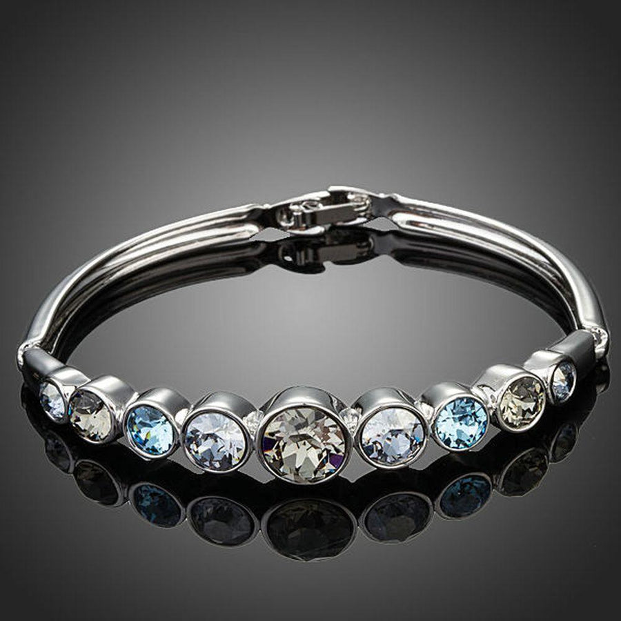 KHAISTA lightweight platinum crystal bangle on white background