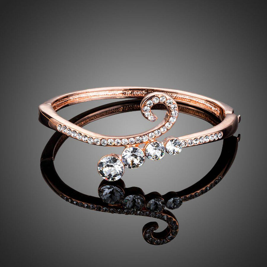 KHAISTA lightweight rose gold plated bangle on white background