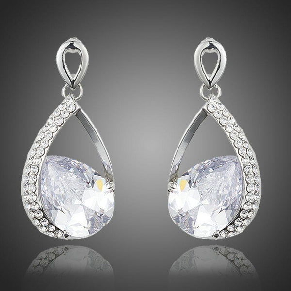 KHAISTA CZ drop earrings on white background