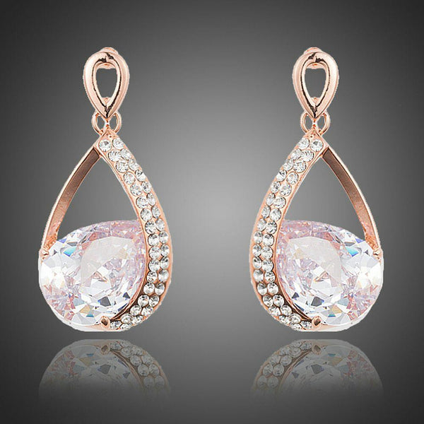 KHAISTA gold plated CZ drop earrings on white background