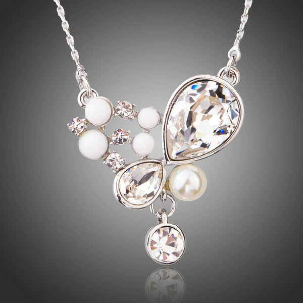 KHAISTA long chain pearl pendant necklace on white background