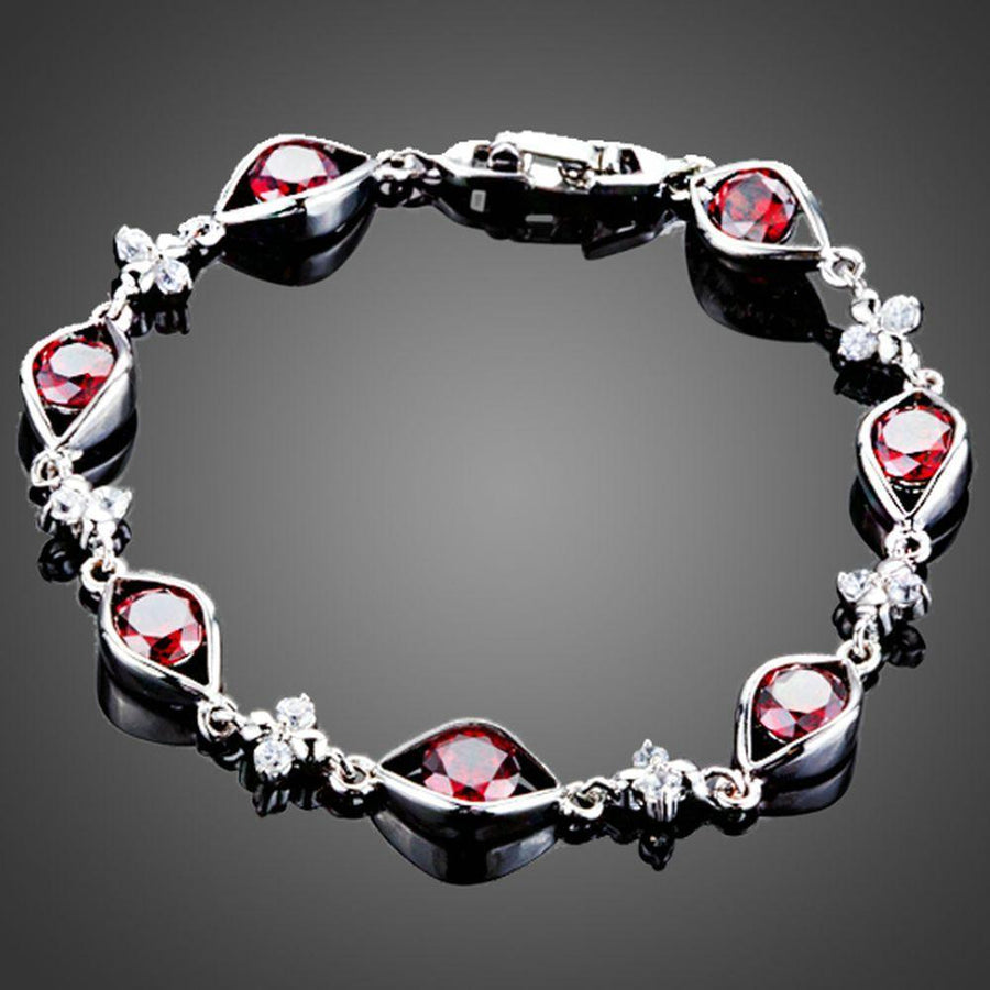 KHAISTA maroon CZ eye shape bracelet on white background