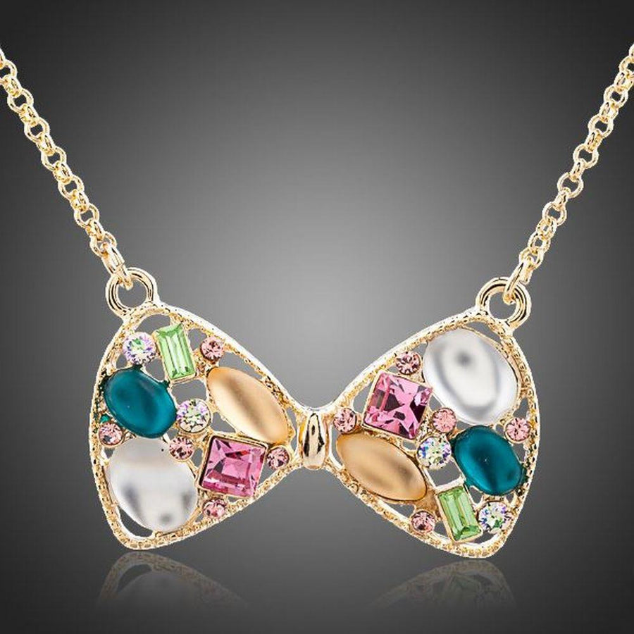 KHAISTA multicolour crystal bow knot necklace on white background