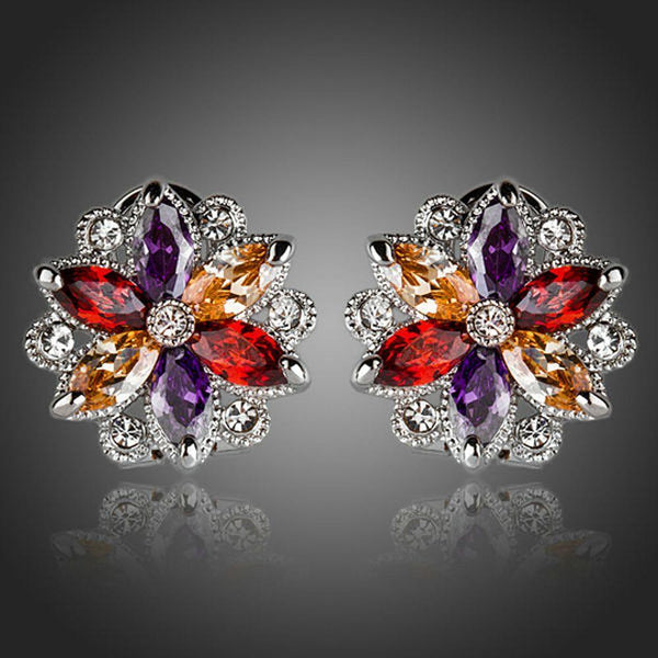 KHAISTA multicoloured flower stud earrings on white background