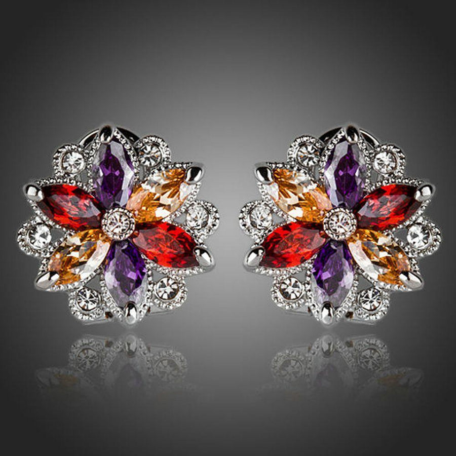 KHAISTA multicoloured flower stud earrings on white background