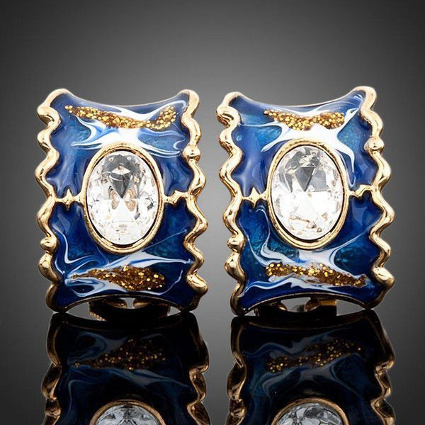 KHAISTA ocean blue crystal clip earrings on white background