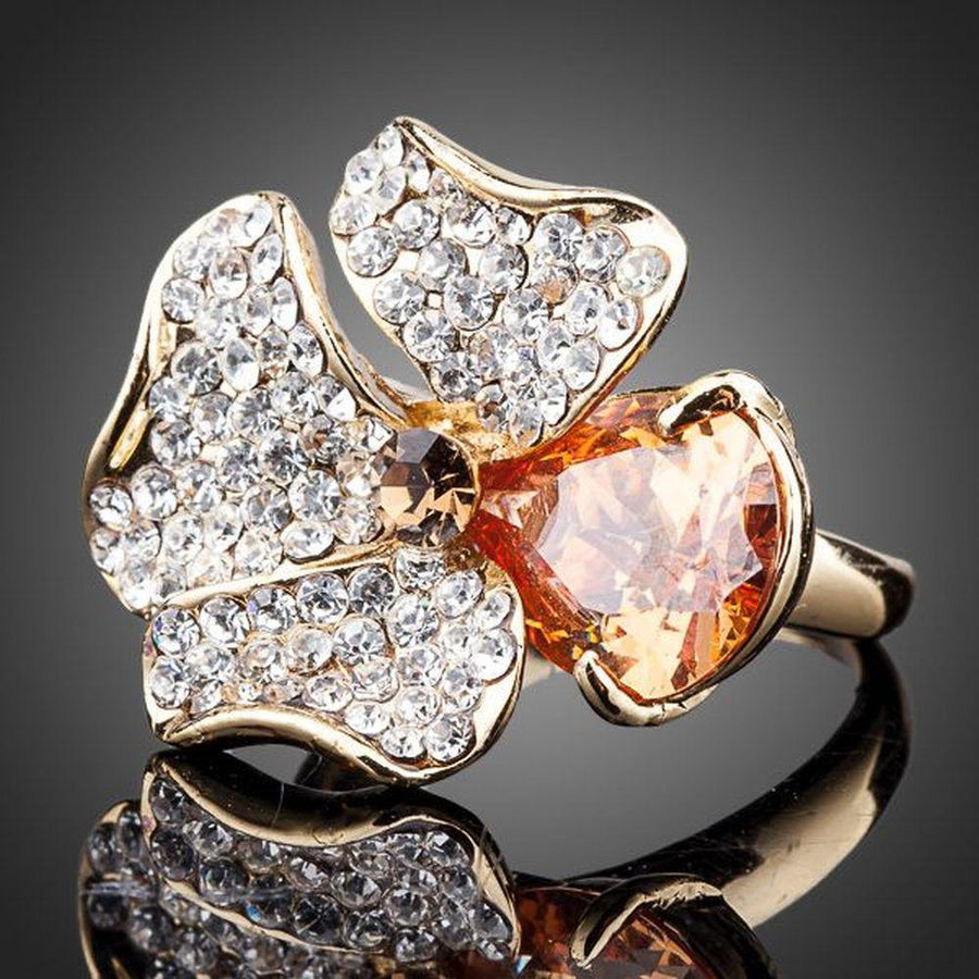 Premium luxury orange flower crystal ring design displayed on a clean white background