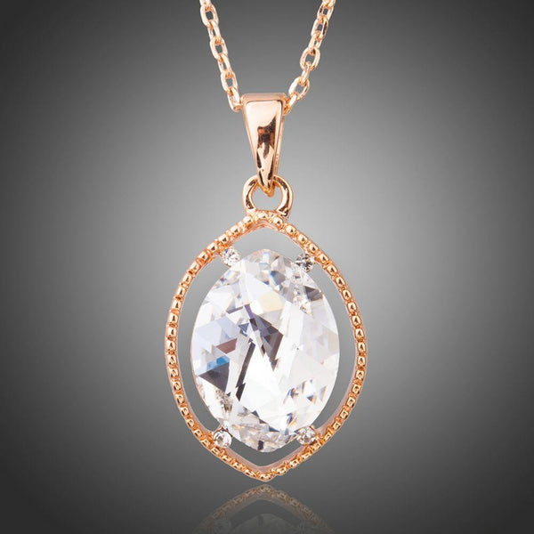 KHAISTA oval crystal pendant necklace on white background