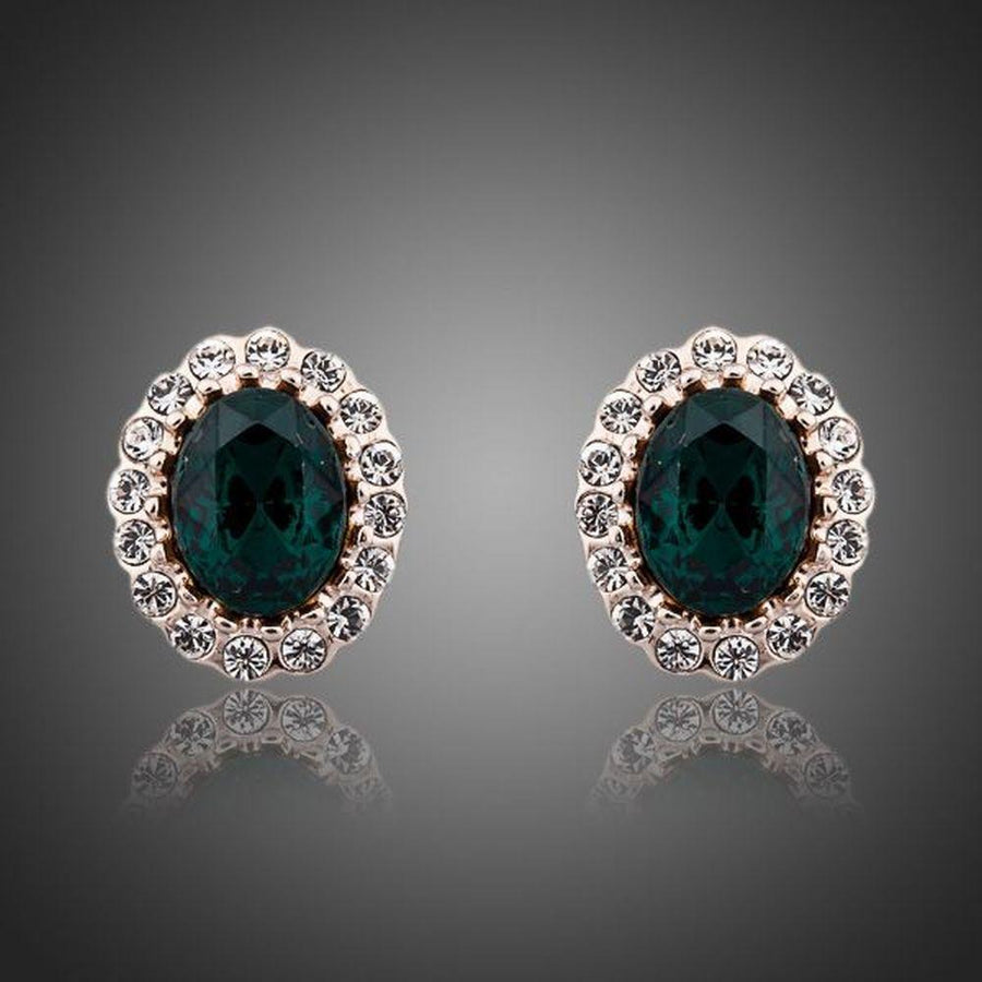 KHAISTA oval ellipse CZ stud earrings on white background