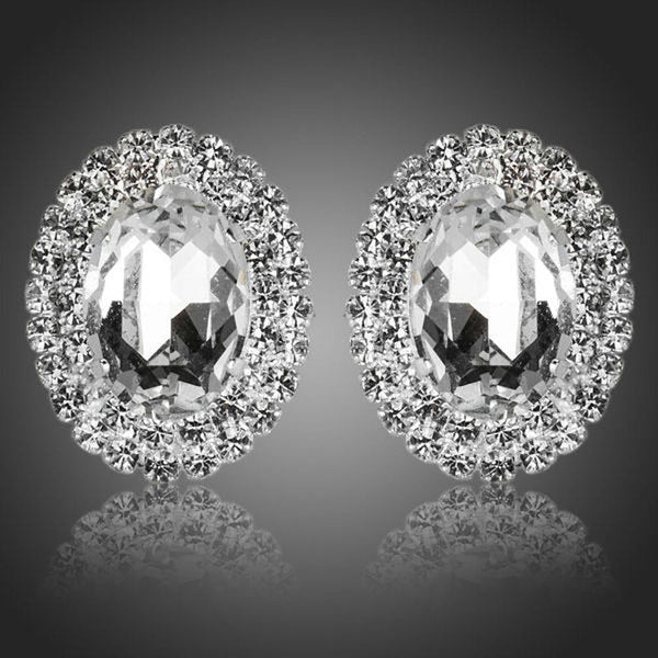 KHAISTA oval silver CZ stud earrings on white background