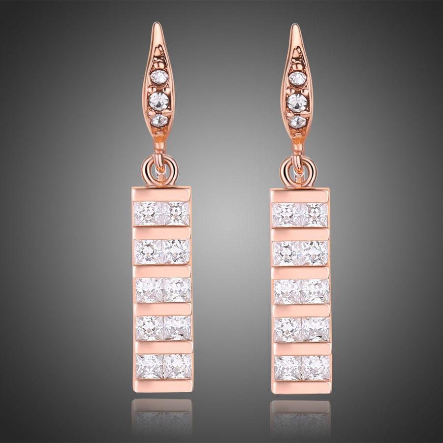 KHAISTA paved square cut rectangle drop earrings on white background