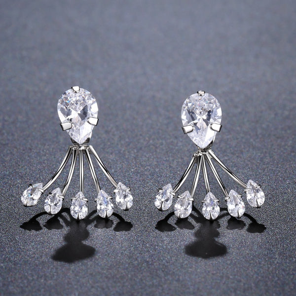 KHAISTA crystal paw design drop earrings on white background
