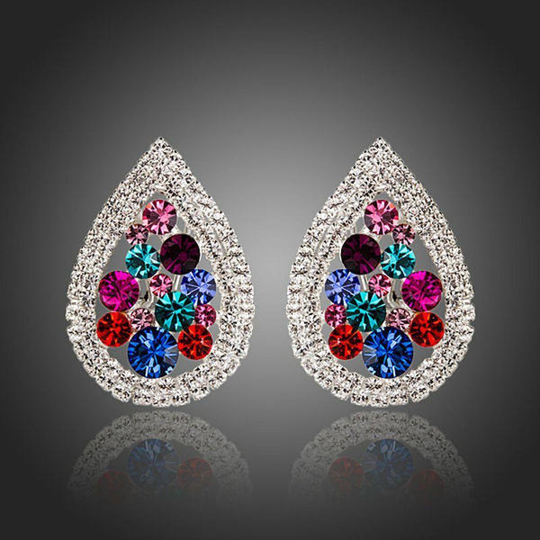 KHAISTA pear shaped CZ stud earrings on white background