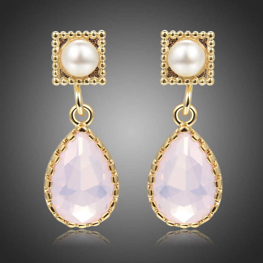 KHAISTA pink opal crystal drop earrings on white background