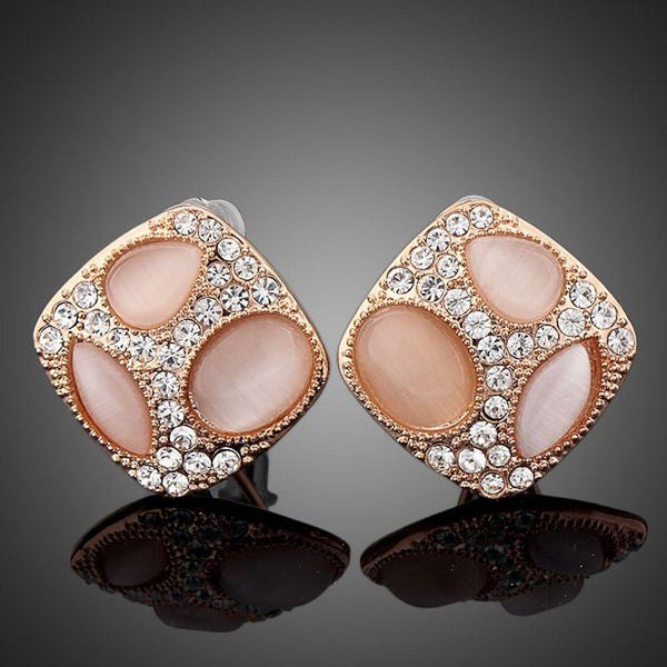 KHAISTA popping eyes emoji crystal stud earrings on white background