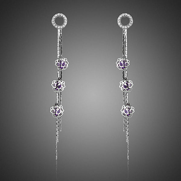 KHAISTA purple CZ drop earrings on white background