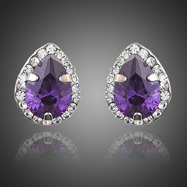 KHAISTA purple CZ pear shaped stud earrings on white background