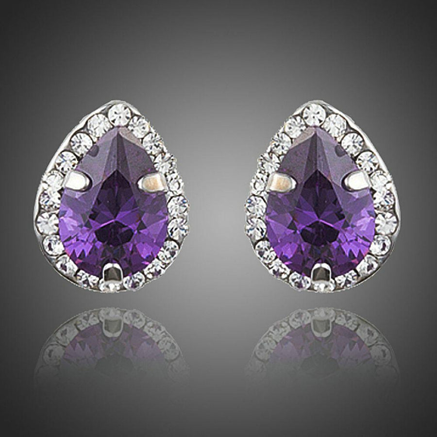 KHAISTA purple CZ pear shaped stud earrings on white background
