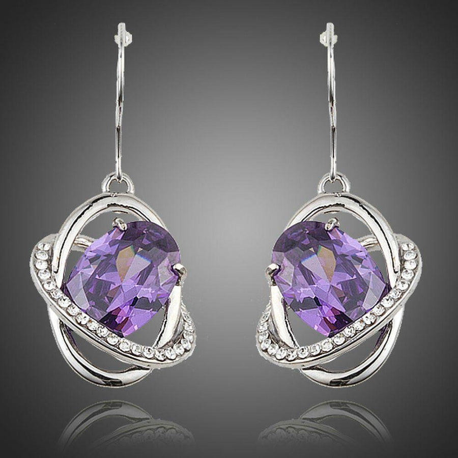 KHAISTA purple halo crystal drop earrings on white background