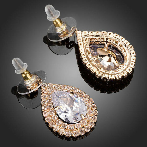 KHAISTA raindrop CZ drop earrings on white background