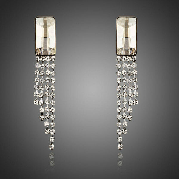 KHAISTA rectangle dangle drop earrings on white background