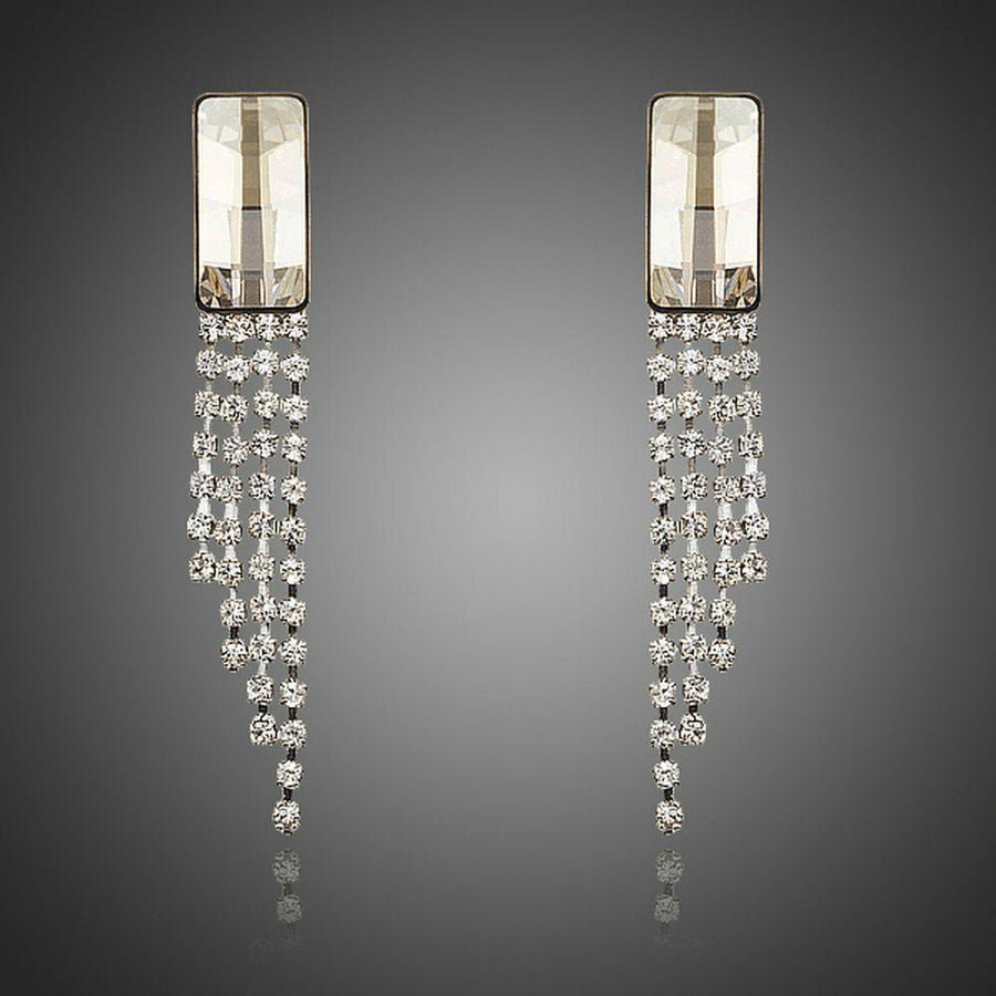 KHAISTA rectangle dangle drop earrings on white background