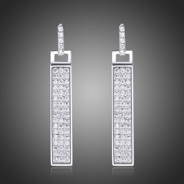 KHAISTA rectangle paved CZ dangle earrings on white background