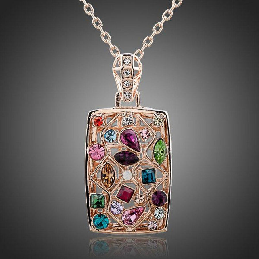 KHAISTA rainbow crystal rectangle pendant necklace on white background