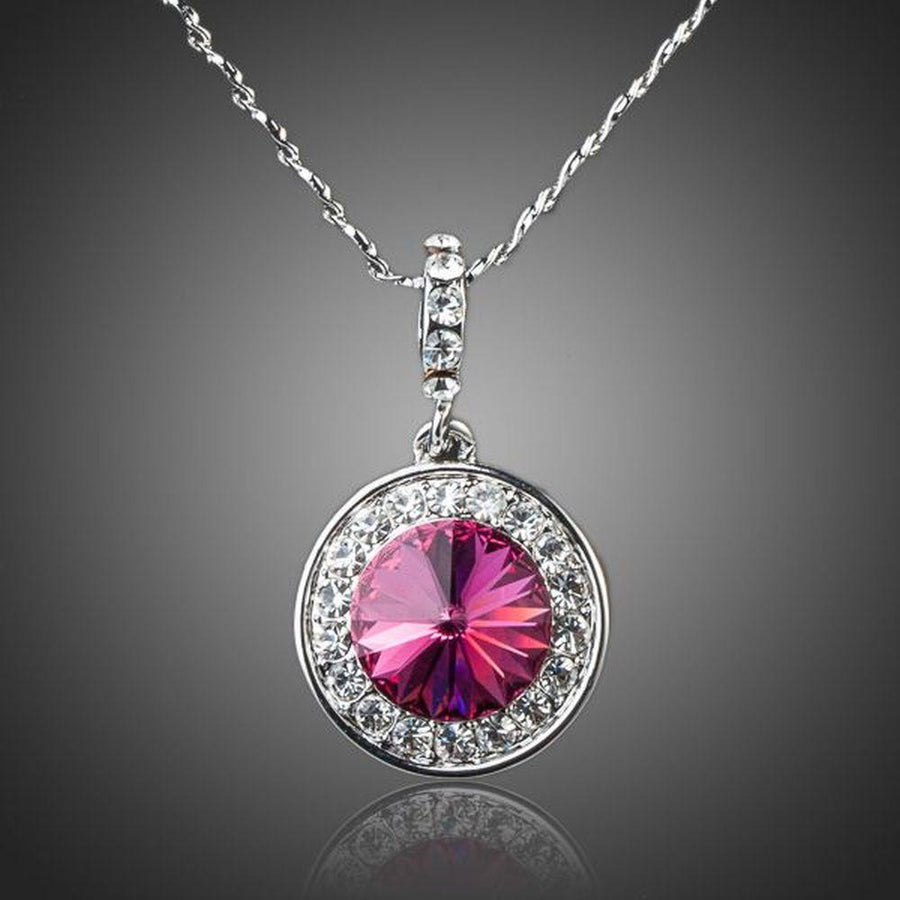 KHAISTA red round crystal pendant necklace on white background