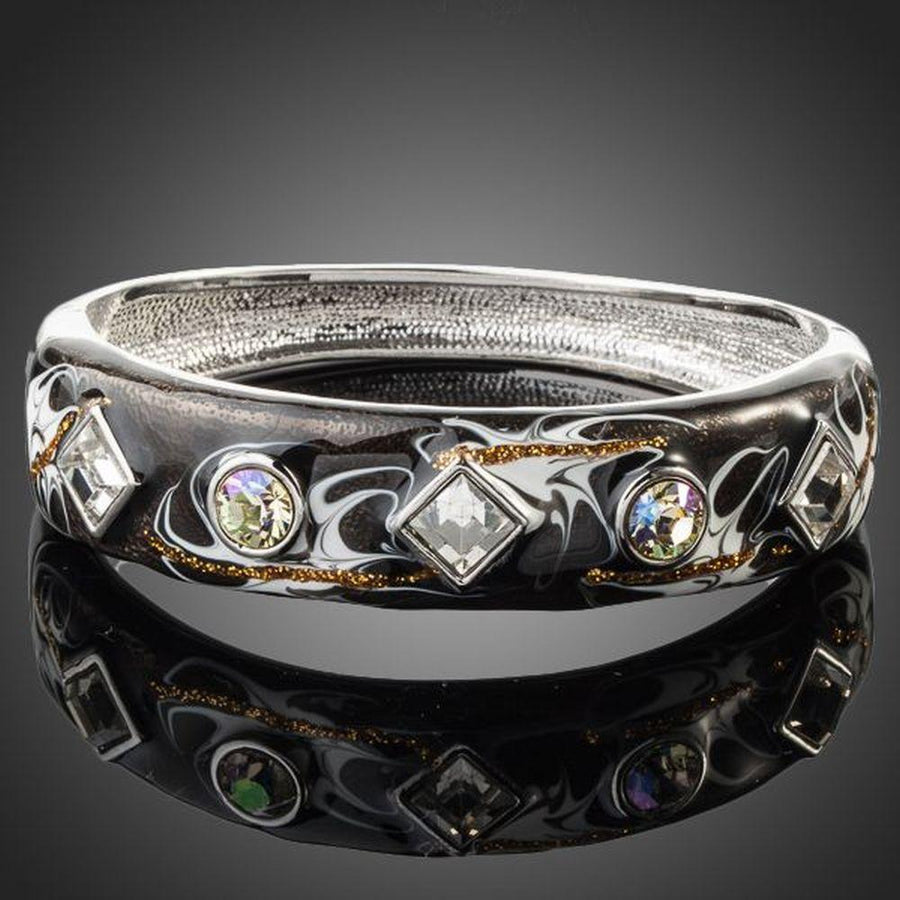KHAISTA rhodium plated black artistic cuff bangle on white background