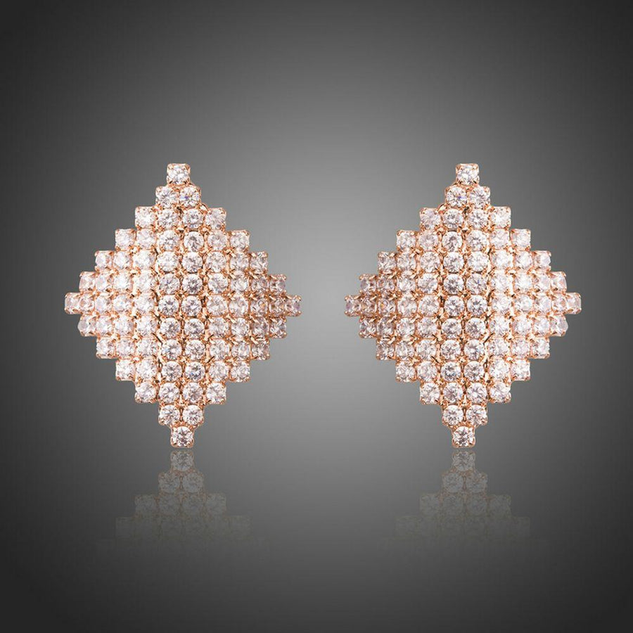 KHAISTA rhombic crystal stud earrings on white background