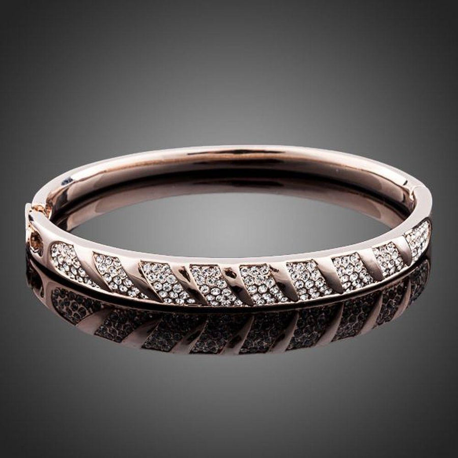 KHAISTA rose gold classic bangle on white background
