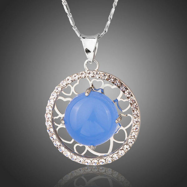 KHAISTA round blue opal pendant necklace on white background