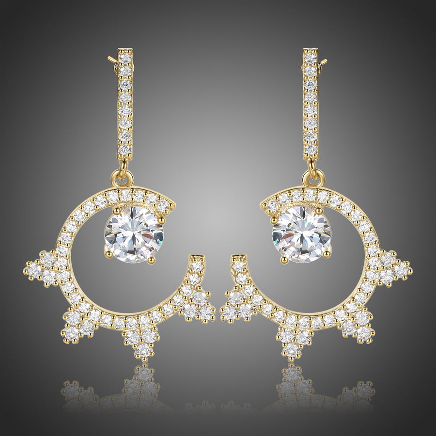 KHAISTA round crystal dangle earrings on white background