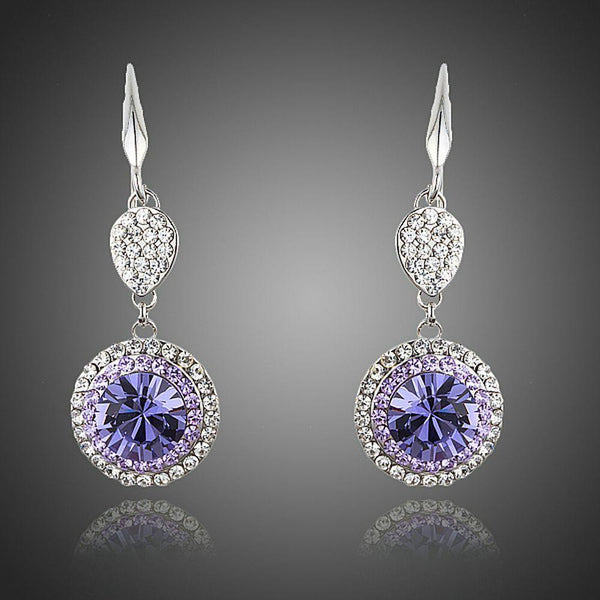 KHAISTA round purple CZ drop earrings on white background