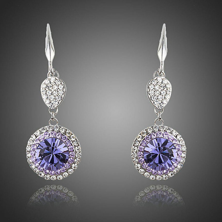KHAISTA round purple CZ drop earrings on white background