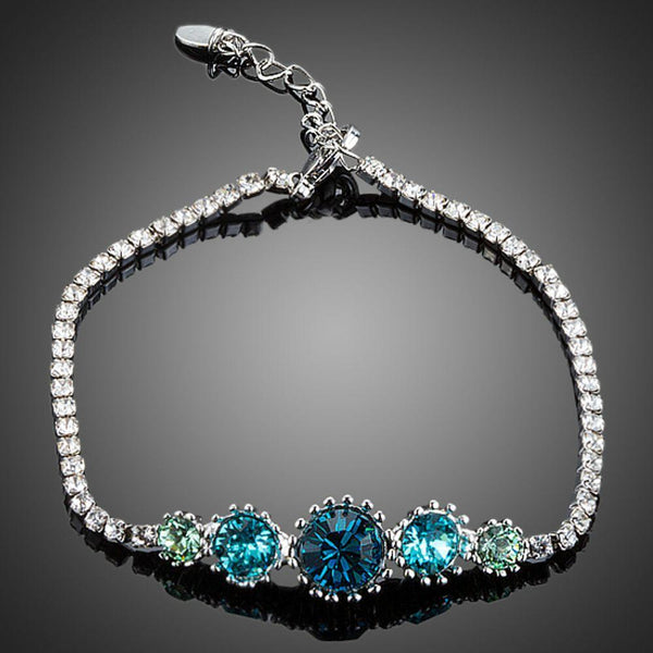 KHAISTA sea blue round crystal stud bracelet on white background