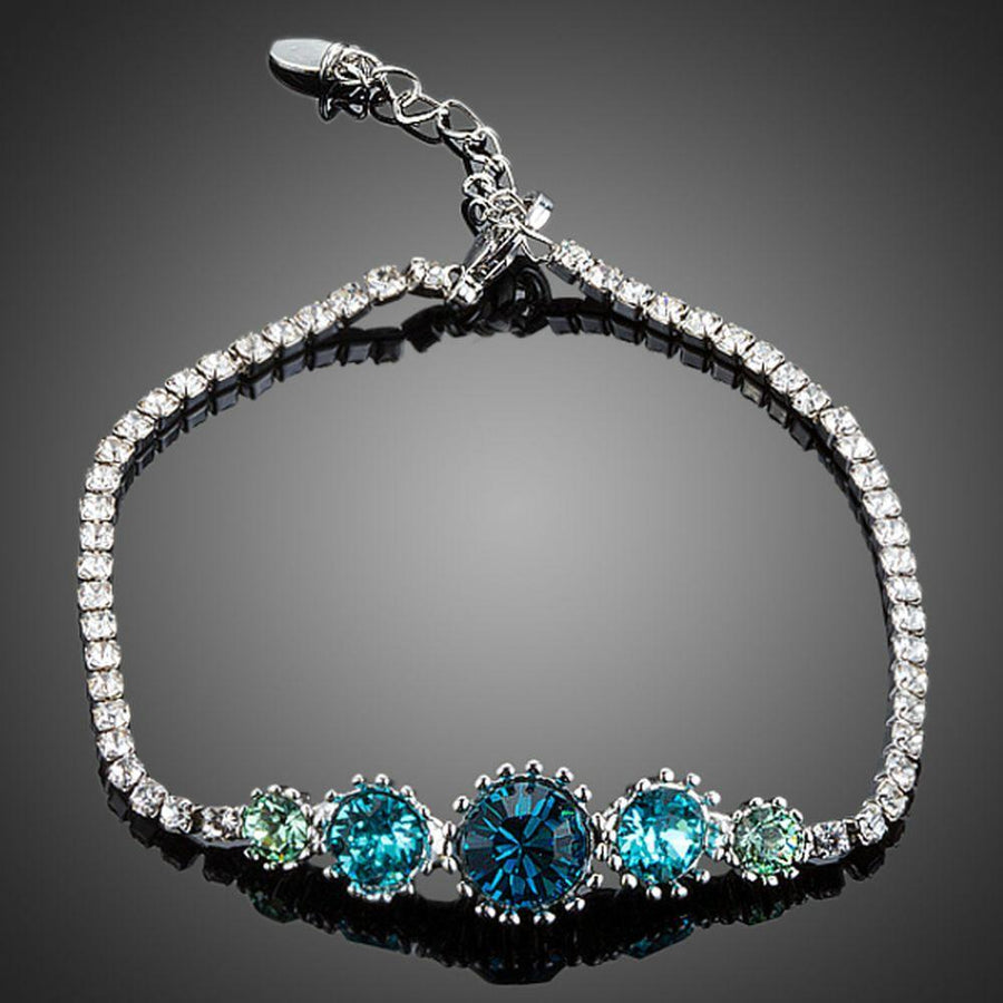 KHAISTA sea blue round crystal stud bracelet on white background