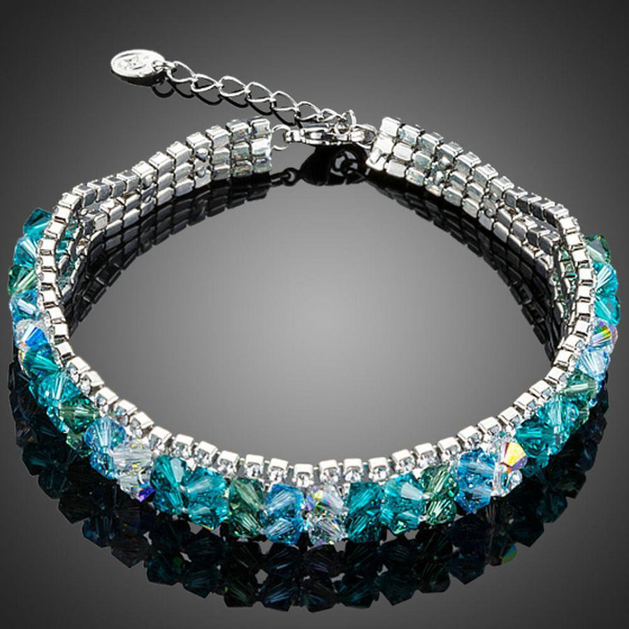KHAISTA sea blue lobster clasp bracelet on white background