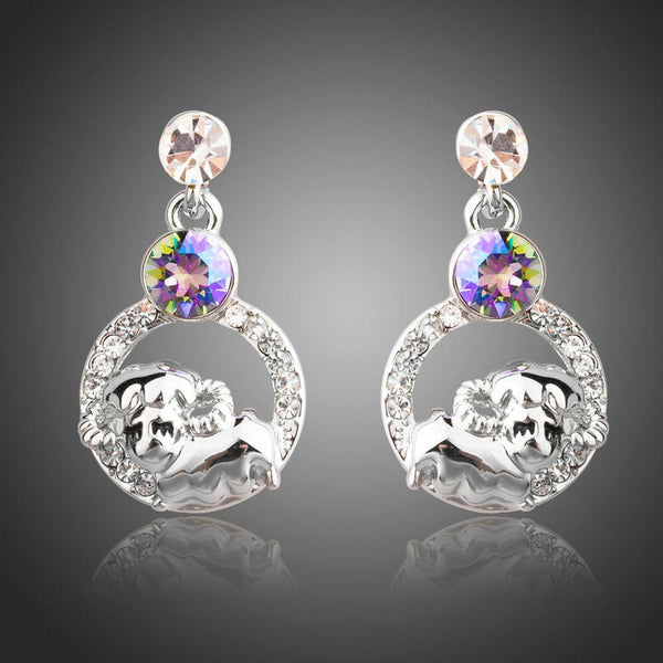 KHAISTA crystal sheep design dangle earrings on white background
