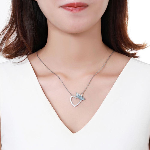 KHAISTA silver heart crown CZ pendant necklace on white background